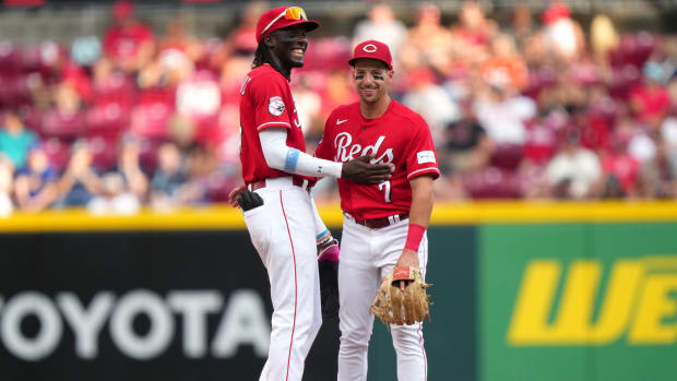 Cincinnati Reds third baseman Elly De La Cruz (44) and Cincinnati Reds first baseman Spencer Steer (7) share a laugh in the eighth inning of a baseball game between the Seattle Mariners and the Cincinnati Reds, Monday, Sept. 4, 2023, at Great American Ball Park in Cincinnati. The Cincinnati Reds won, 6-3. 
